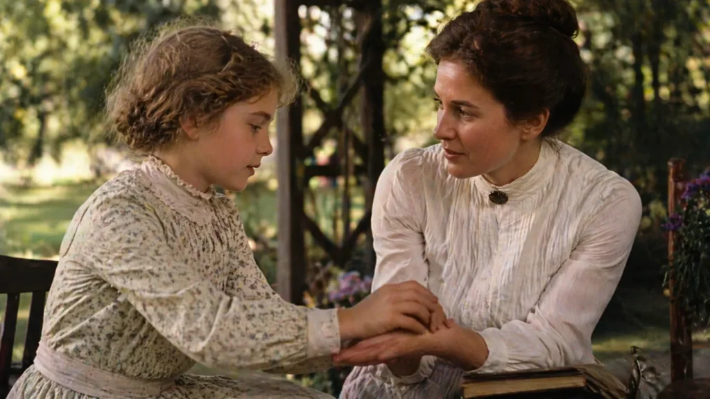 Helen Keller jovem aprendendo com Anne Sullivan